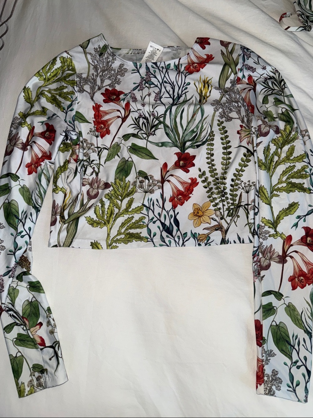 Vitamin A White Floral Long-Sleeve Crop Rash Guard